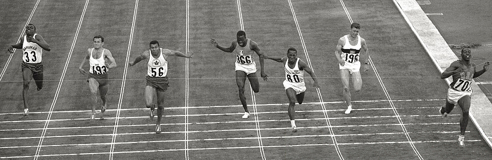 The finish of the men's 100 metres at the 1964 Tokyo Olympics, Bob Hayes (366) breasting the tape.
